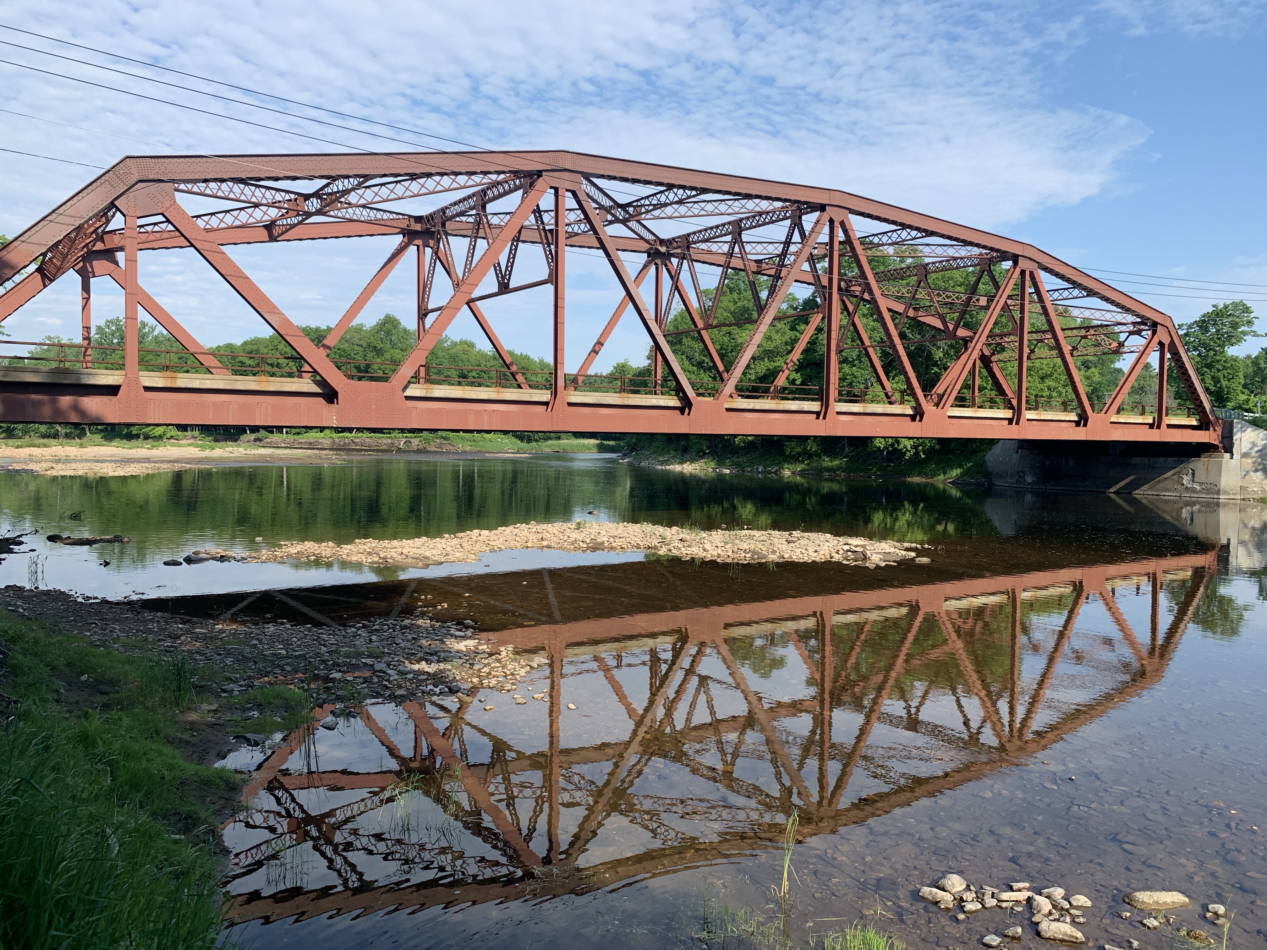 Side view of Carpenter's Flats Bridge showing the reflection in the water.